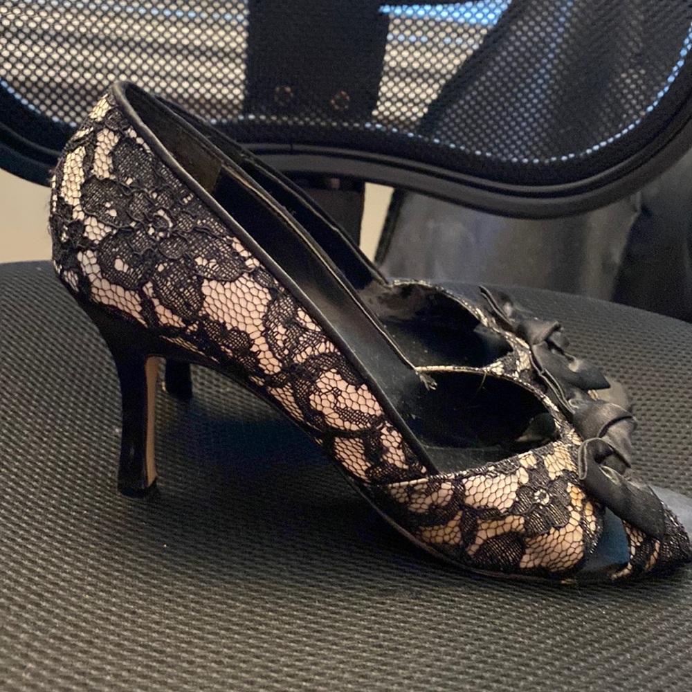 Gossip, beige with black lace and a bow